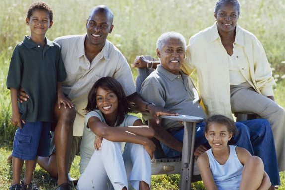 Smiling Family Posing in Field