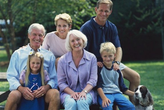 Smiling Family Posing on Bench